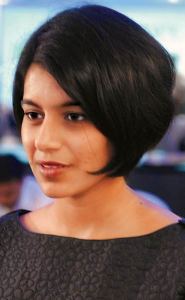 Lakshmi Venu of TVS wears a bob hairstyle